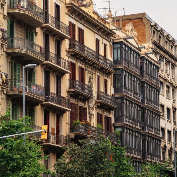 Row of old buildings made in classic style in Barcelona, Spain